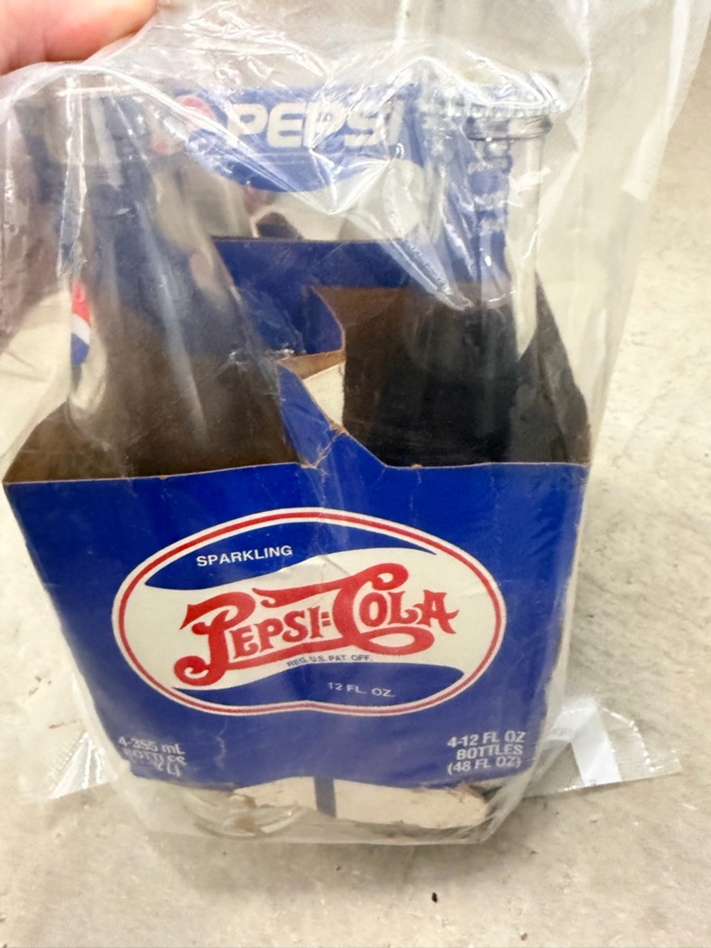 1998ish Pepsi Cola bottles (one still capped and full)